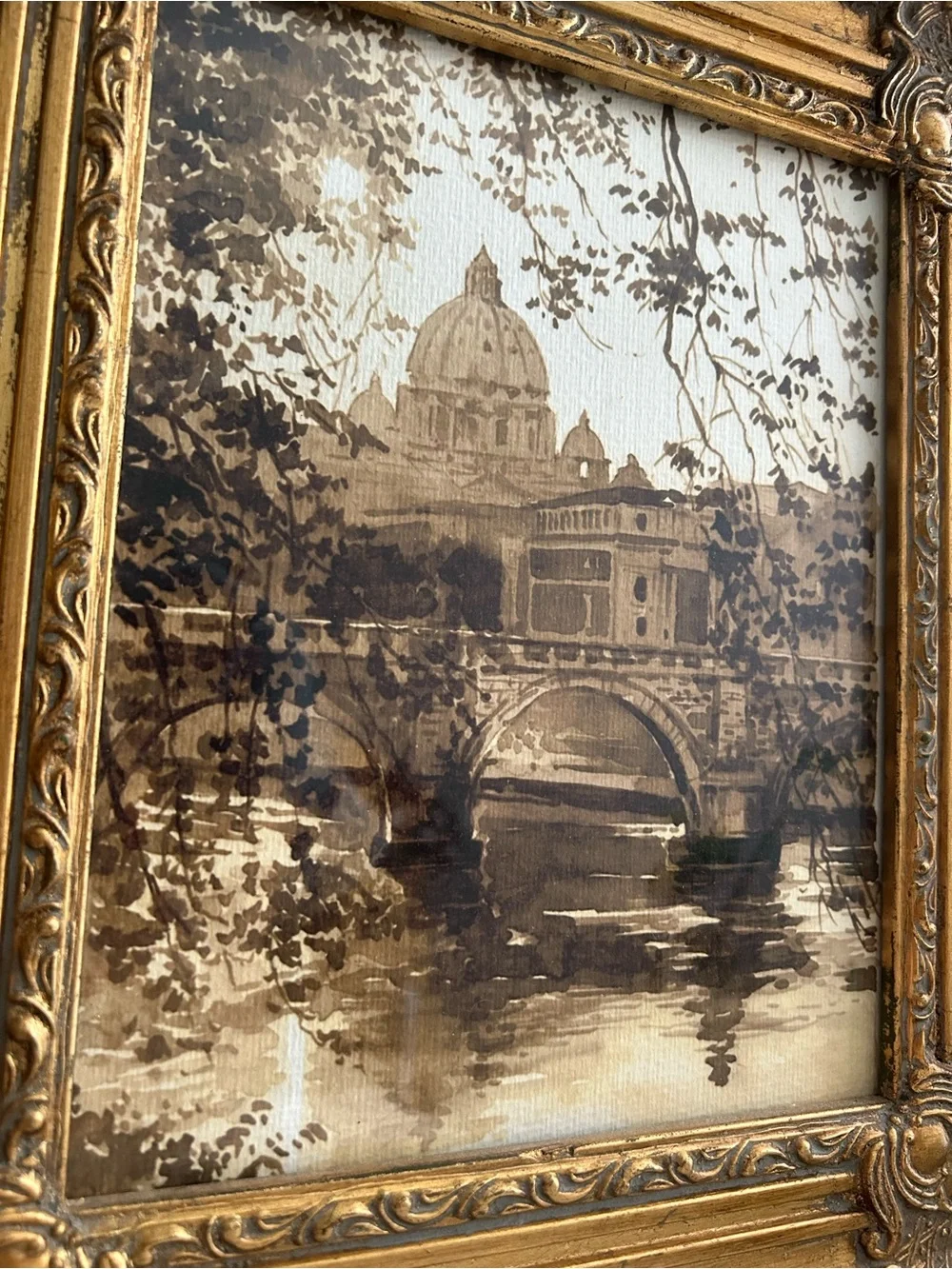 Framed art in gilded ornate frame